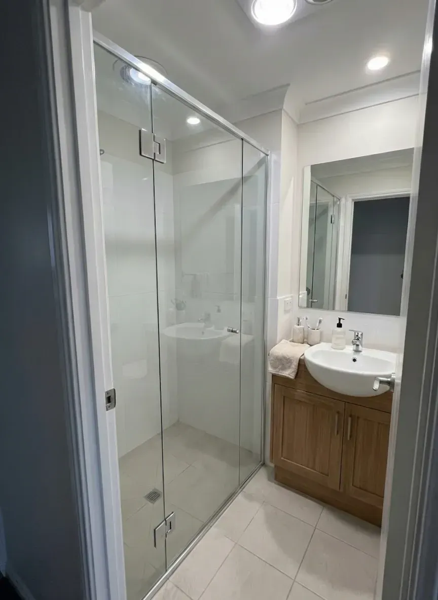 repaired shower screen glass panel and bathroom mirror replacement in Brisbane home